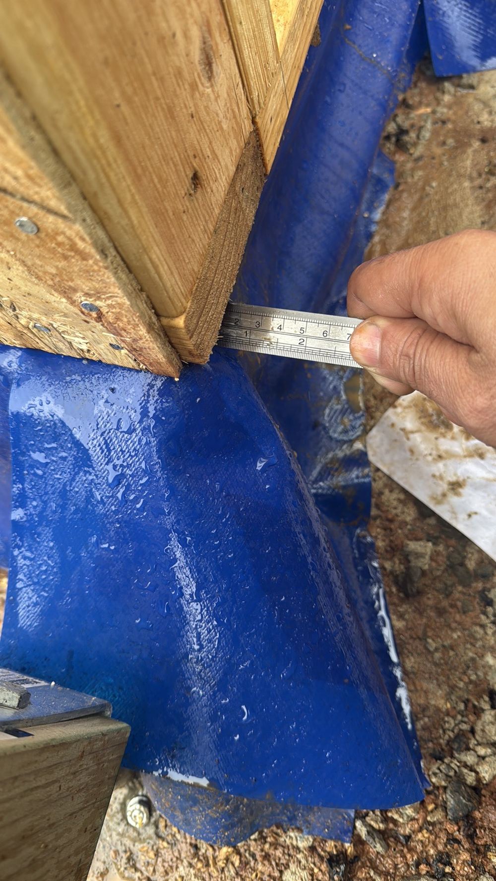 Bottom plates hanging more than 10mm past the slab edge, reducing their bearing, found during a frame inspection in Truganina