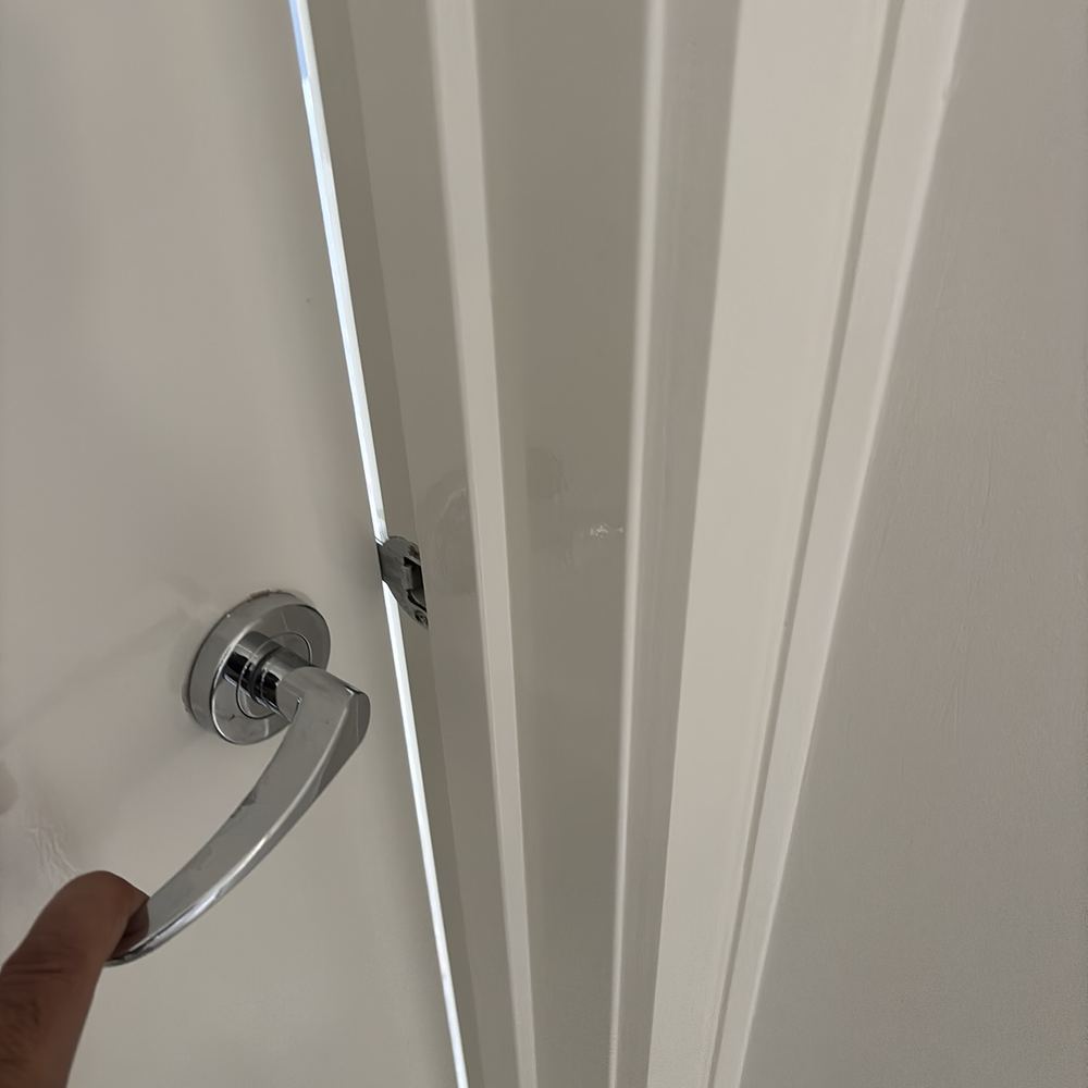 Door hard to open and close, which can follow movement in a house, found during a defect investigation inspection in Derrimut