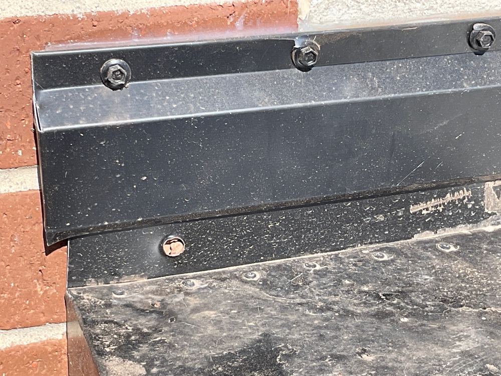 Damaged roof flashing found during the handover inspection, found during a pre-handover inspection in Truganina