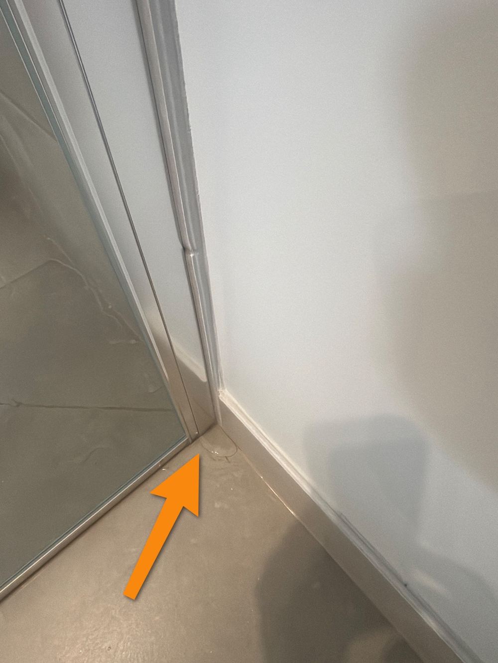Ensuite shower screen letting water escape onto the floor, found during a pre-handover inspection in Truganina