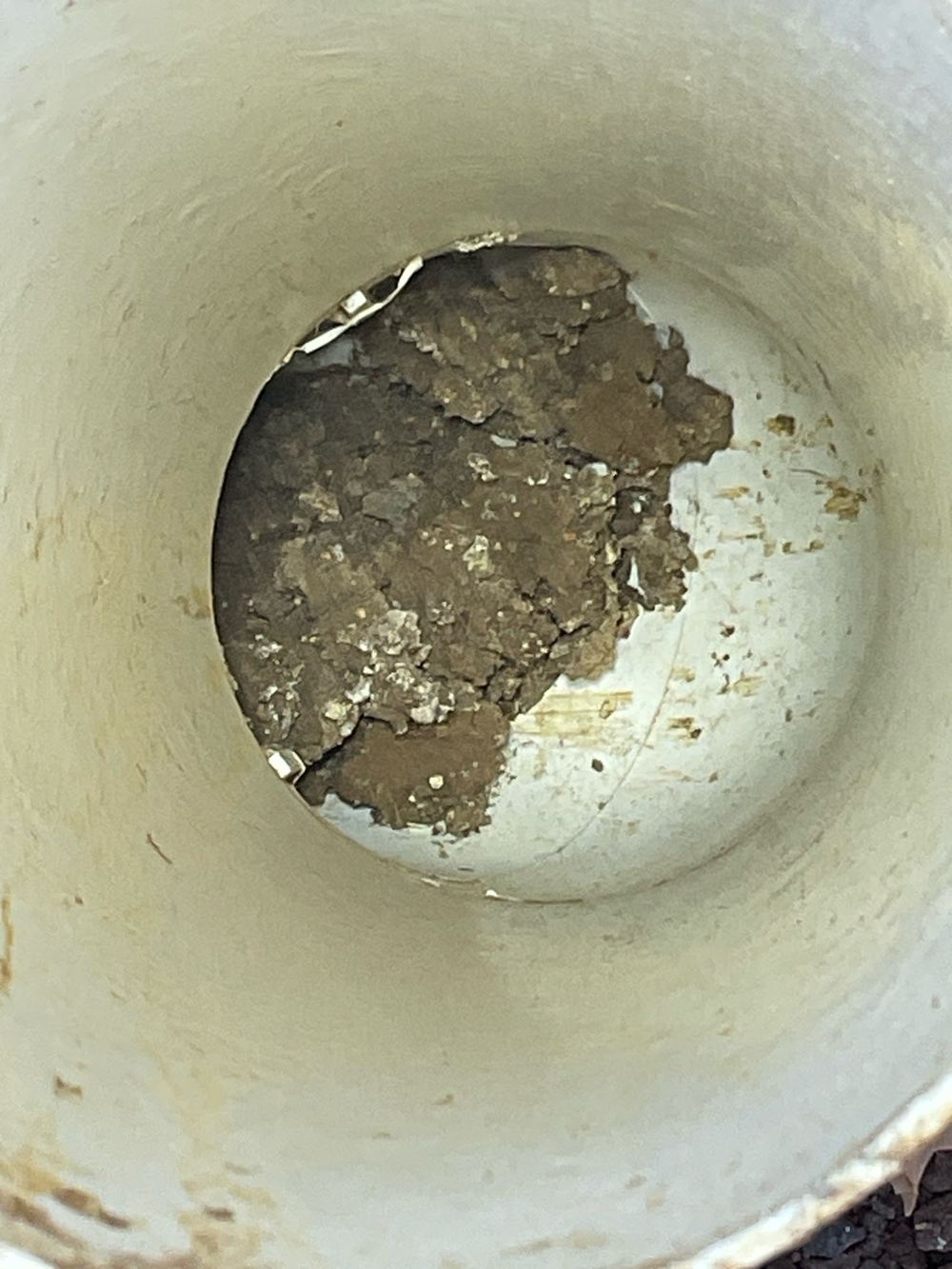 Stormwater pipe broken or blocked at handover, needing repair and a camera check, found during a pre-handover inspection in Truganina