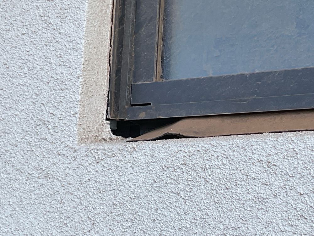 Gap between window and cladding too wide for the flashing and left uncaulked, found during a pre-handover inspection in Truganina