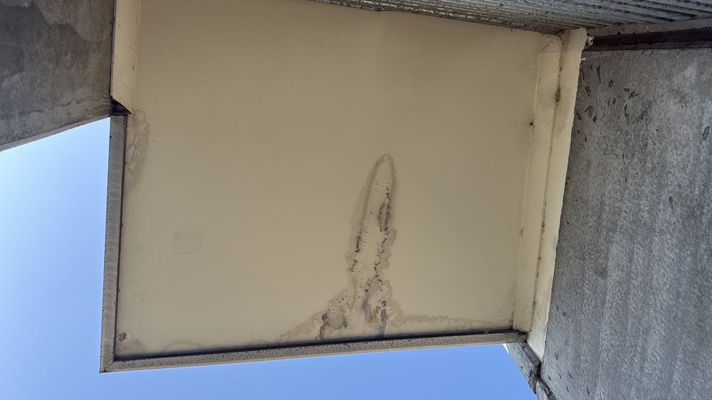 Water stains under the eaves that may mean an active roof leak, found during a pre-purchase inspection in Deer Park