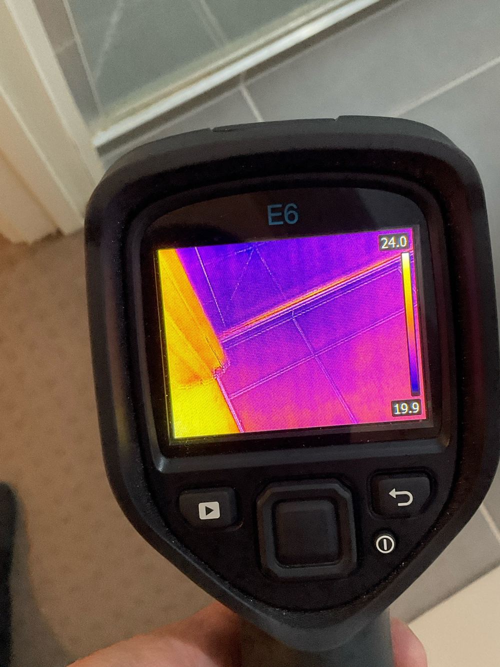 Water damage on the floor outside the shower recess, found during a pre-purchase inspection in Truganina