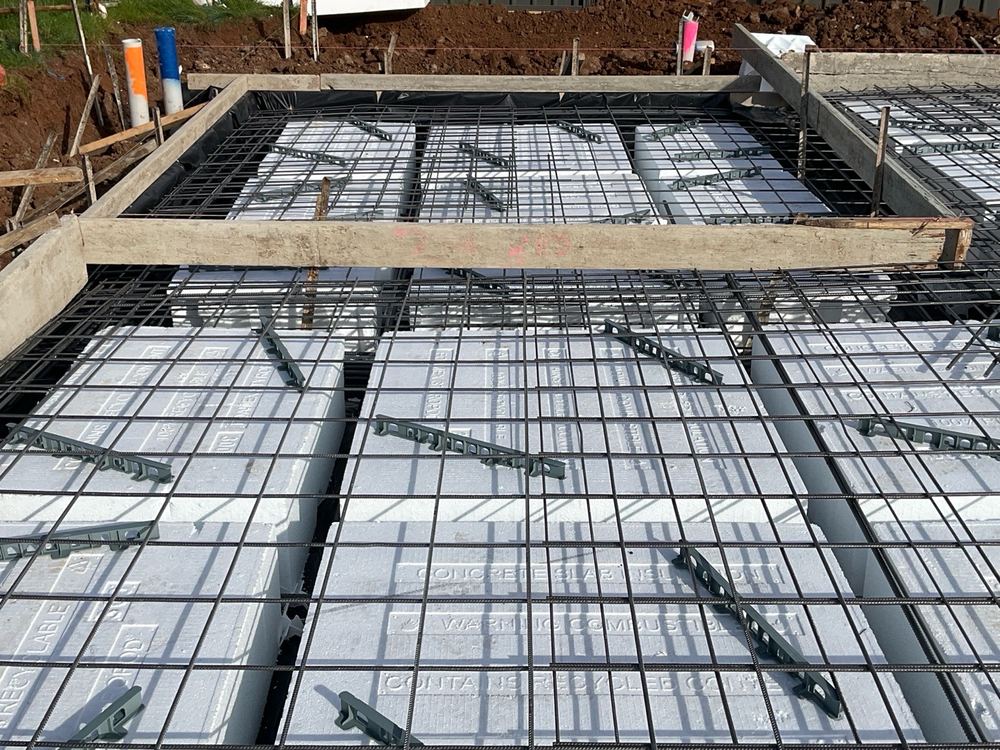 Slab mesh sagging between supports, which would leave uneven concrete cover, found during a slab pre-pour inspection in Truganina